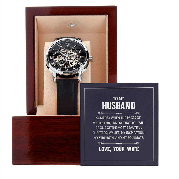 Openwork watch for men in a wooden box, featuring a black leather band and transparent dial showcasing intricate mechanics, ideal for gifting.