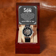 Openwork Watch for Son in luxury mahogany box with black leather band and visible mechanics.