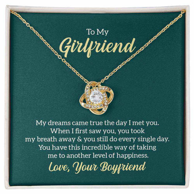 Love Knot Girlfriend Necklace with a cubic zirconia stone, featuring a gold love knot pendant, perfect gift for anniversaries.
