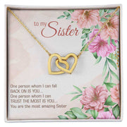 Interlocking Heart Necklace with gold finish, cubic zirconia crystals, gift packaging.