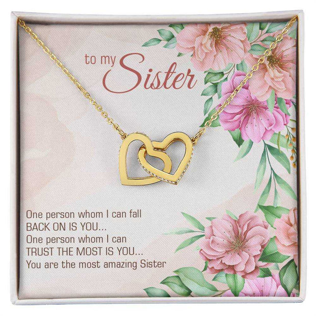 Interlocking Heart Necklace with gold finish, cubic zirconia crystals, gift packaging.