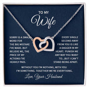 Interlocking Hearts Wife Necklace featuring two intertwined heart pendants with CZ crystals, shown in a gift box with a heartfelt message.