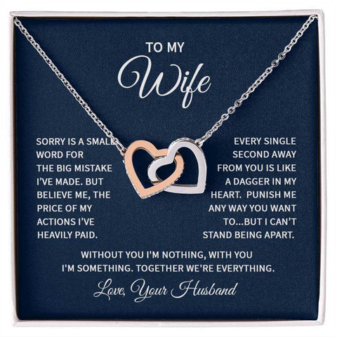Interlocking Hearts Wife Necklace featuring two intertwined heart pendants with CZ crystals, shown in a gift box with a heartfelt message.
