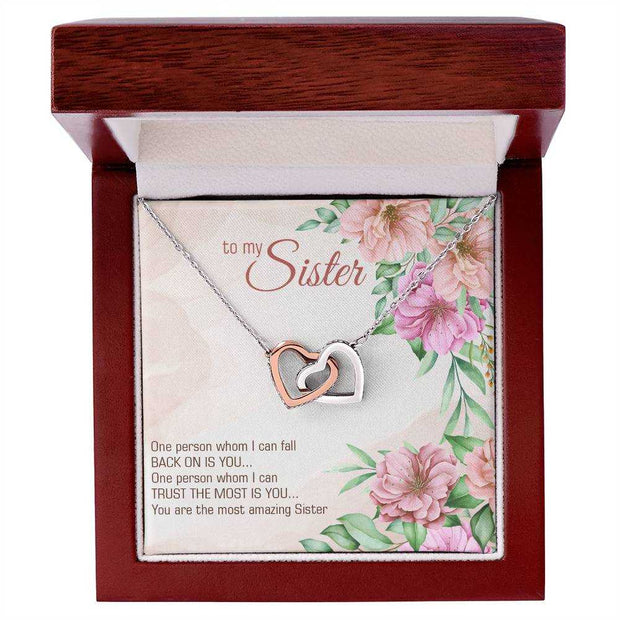 Interlocking Heart Necklace in gift box, featuring two heart pendants, perfect for expressing love and positivity.