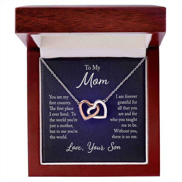 Interlocking Hearts Mom Necklace in gift box, symbolizing mother-child bond.