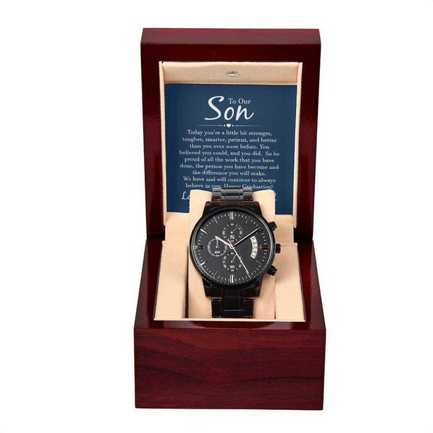 Black chronograph watch in gift box with three-dial face and calendar function.