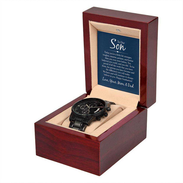 Black chronograph watch in a gift box with inscription.