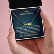 Custom name necklace in a gift box with a personalized message card.
