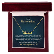 Custom name necklace in gold with personalized engraving, displayed in a luxury box.