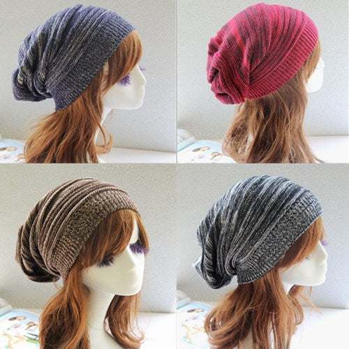 Pleated Pullover Hatt in various shades on mannequin heads.