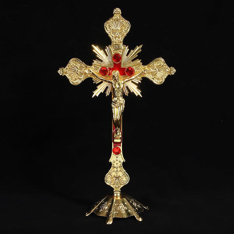 Vibrant Religious Cross Ornament in gold finish with intricate design and red accents, symbolizing faith and devotion.