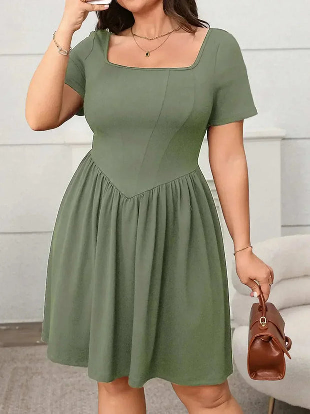 Plus size square-neck short-sleeve mini dress, showcasing a flattering fit and modern design in green.