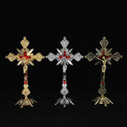 Multicolor religious cross ornaments in gold, silver, and bronze displaying vibrant design and intricate detailing.