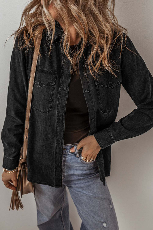 Black denim button-up jacket with long sleeves and chest pockets.