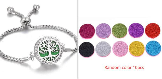 Hollow Stainless Steel Aromatherapy Bracelet with essential oil pads and tree design.