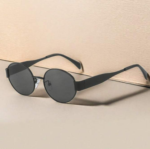 Vintage Metal Oval Sunglasses for Women on a neutral background.