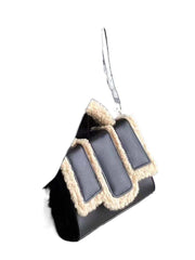 Black lambs wool crossbody bag with soft texture and stylish design.