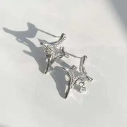 Elegant Asterism Rhinestone Earrings with geometric metal design reflecting star-like sparkle.