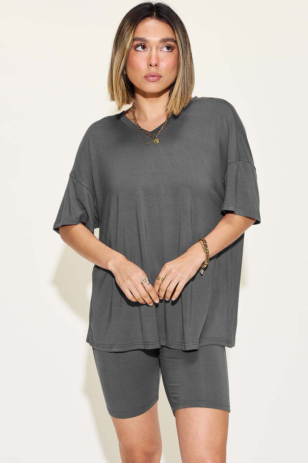 Woman wearing Basic Bae V-Neck Shorts Set with relaxed fit V-neck top and matching shorts in breathable fabric