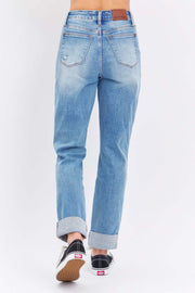 Judy Blue Distressed Straight Jeans with faded wash and rolled cuffs, back view.