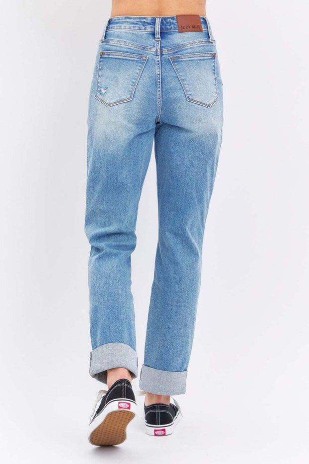 Judy Blue Distressed Straight Jeans with faded wash and rolled cuffs, back view.