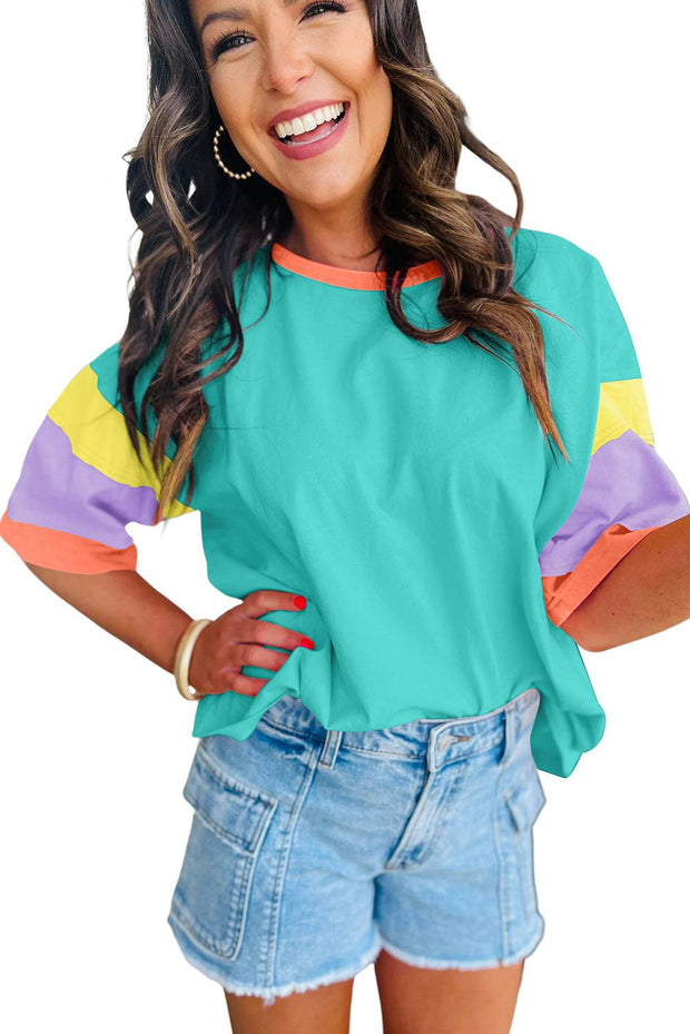 Oversize Color Block Top with round neckline, vibrant sleeves, and relaxed fit for casual wear.