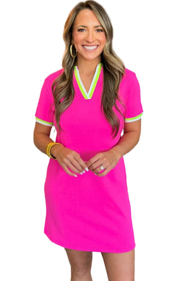 Bright pink dress with contrast V-neck and short sleeves.