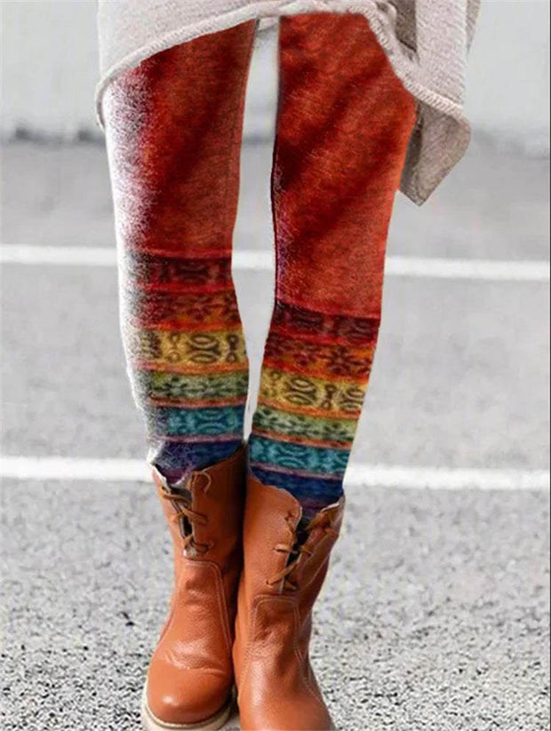 Colorful printed flared trousers with ankle boots.