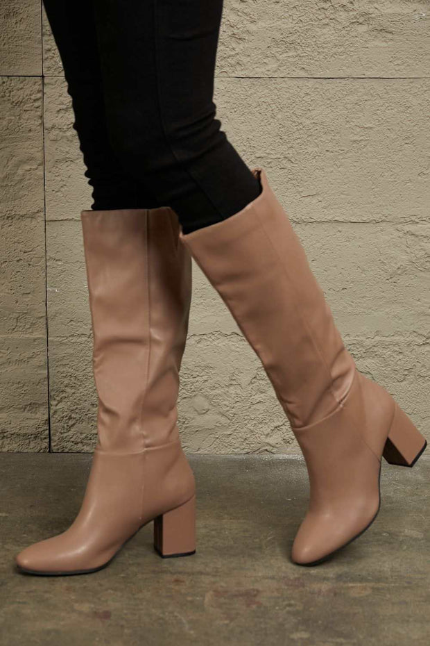 East Lion Knee High Boots with block heel, elegant and durable design.