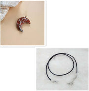 Moon Tree Of Life Necklace with crescent moon pendant and black leather rope.