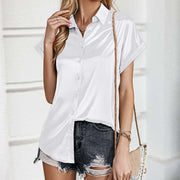 White short sleeve blouse with a relaxed fit, perfect for stylish summer wear and versatile pairing with skirts or jeans.
