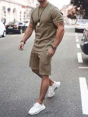 Plus size short sleeve top and shorts set in khaki, featuring a relaxed fit, crew neckline, elastic waistband, and side pockets, ideal for casual wear.