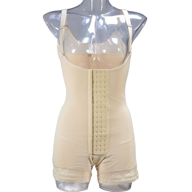 Beige breasted body sculpting pants on clear mannequin displaying high waist and adjustable straps.