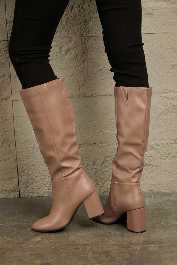 East Lion Knee High Boots with block heel, stylish knee-high design for chic look.