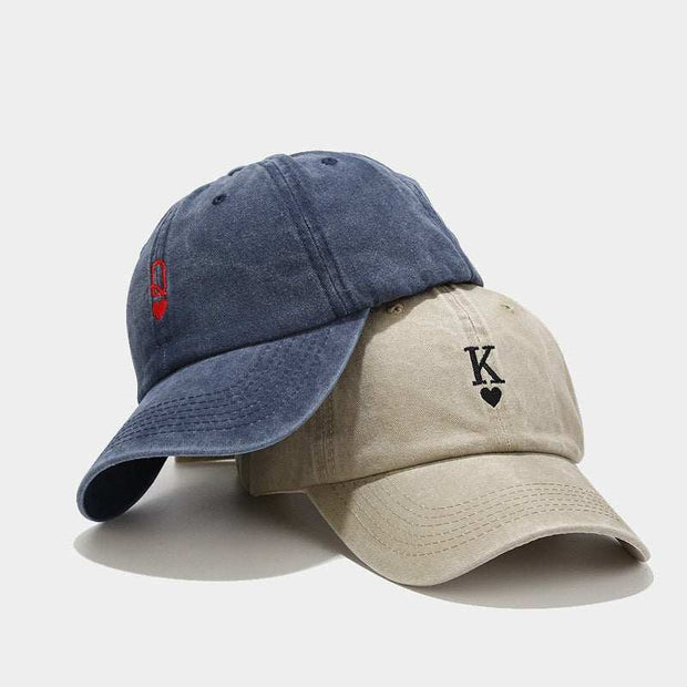 Vintage baseball caps in navy blue and beige with embroidery, showcasing classic style and adjustable fit.