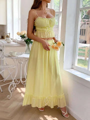 Frill square neck cami and skirt set in yellow with delicate frills and a lightweight fabric, styled elegantly.