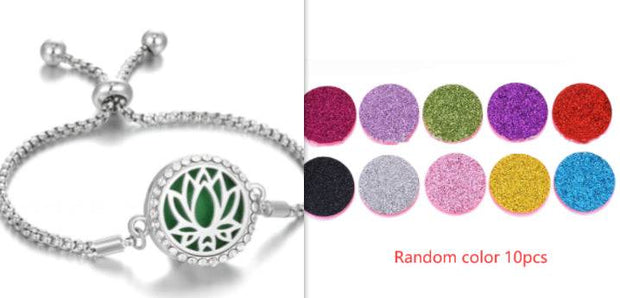 Hollow stainless steel aromatherapy bracelet with colorful essential oil pads.