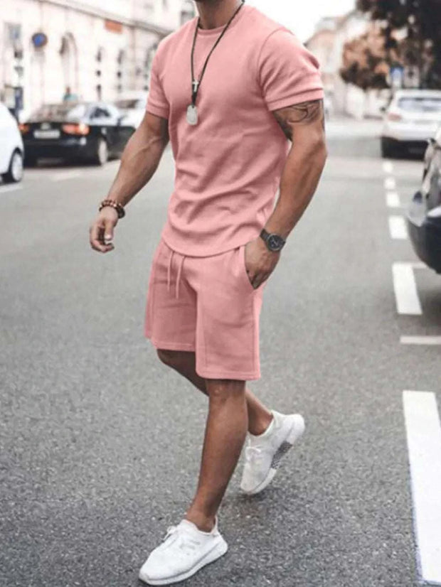 Plus Size Short Sleeve Top and Shorts Set in pink, casual streetwear outfit with elastic waistband and pockets.