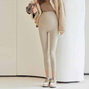 Fleece-lined maternity pants with stretchy waistband for comfort during pregnancy.