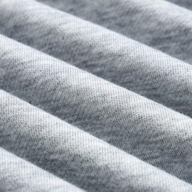 Close-up of soft grey fabric texture for Kitten Graphic Sweatshirt made of cotton-polyester blend