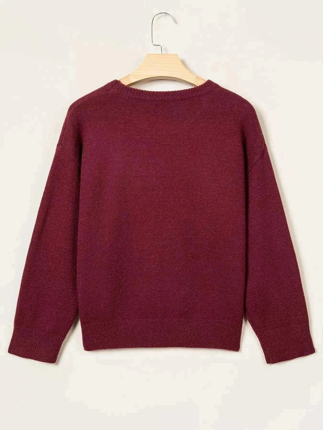 Candy Cane Christmas Sweater in solid burgundy knit with long sleeves, ribbed cuffs and hem, shown from the back