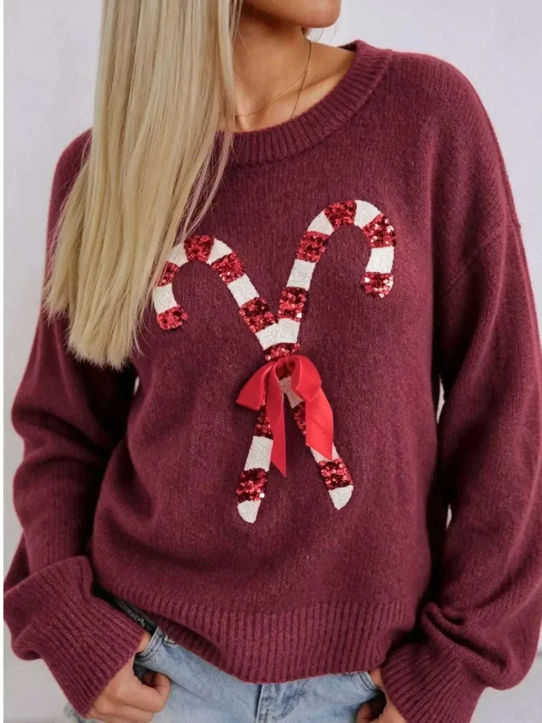 Candy Cane Christmas Sweater in burgundy knit with sequined red-and-white candy canes and a red bow