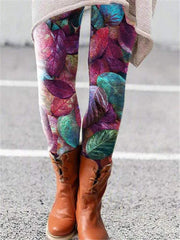 Printed Flared Trousers with colorful leaf pattern and brown boots.