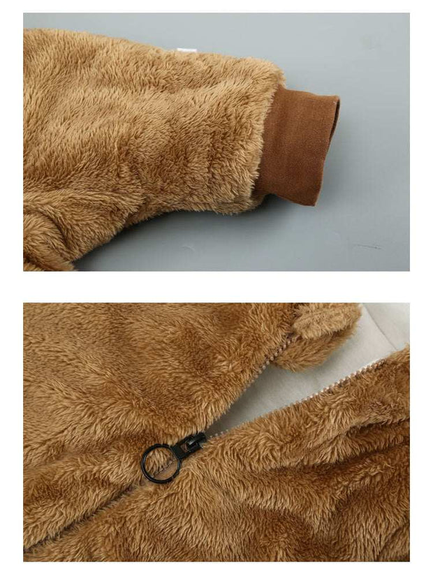 Close-up of a brown baby cotton onesie showing cuff and zipper details.