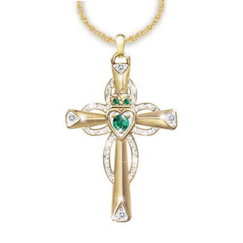 Emerald Cross Necklace with gold accents and emerald stones, elegant religious jewelry piece.