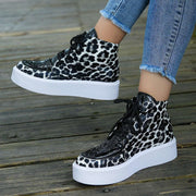 Leather Leopard Platform Sneakers with bold print and cushioned sole.