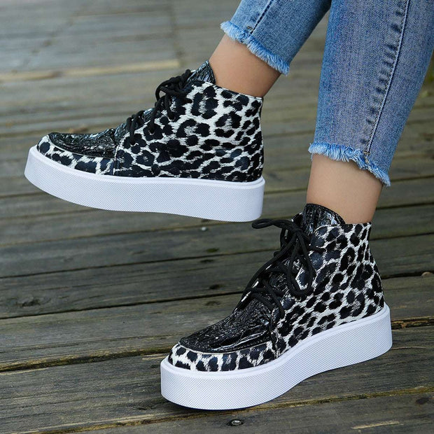 Leather Leopard Platform Sneakers with bold print and cushioned sole.