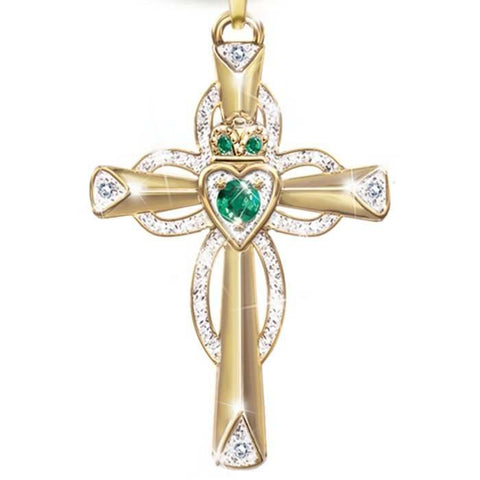 Emerald Cross Necklace with vibrant emerald accents on a gold setting.