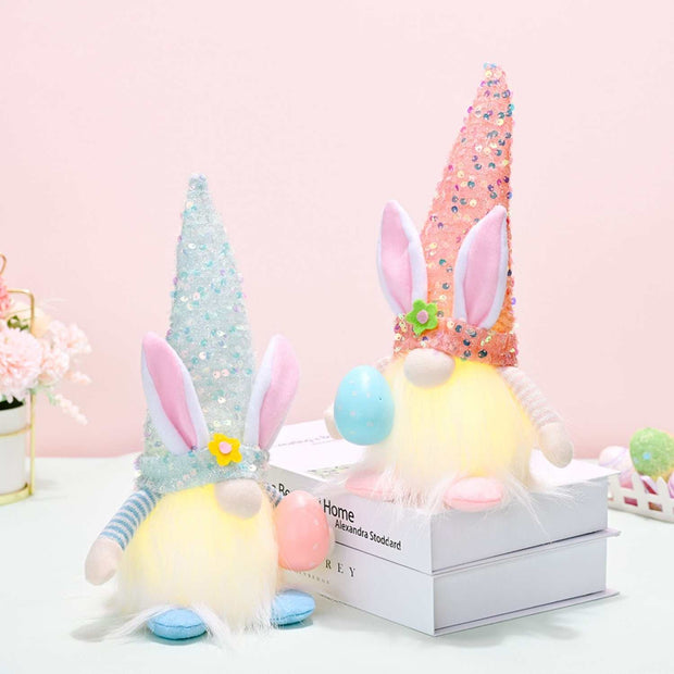 Easter-themed gnome hats with vibrant sequins, decorated with bunny ears and floral accents, ideal for festive celebrations.