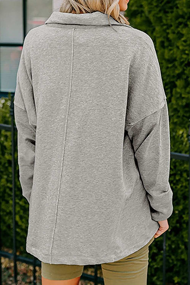 Cozy gray collared neck sweatshirt with long sleeves, ideal for stylish layering.